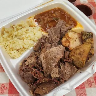 BBQ plate with brisket, chicken, rice pilaf and chili