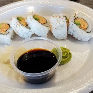 a plate of sushi and sauce