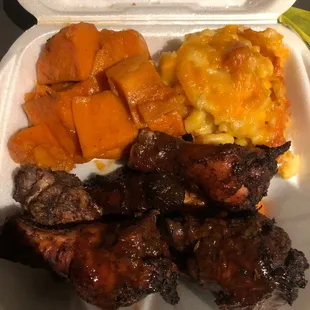 medium-sized platter of jerk wings (with jerk sauce on top), macaroni &amp; cheese and candied yams - yummy!