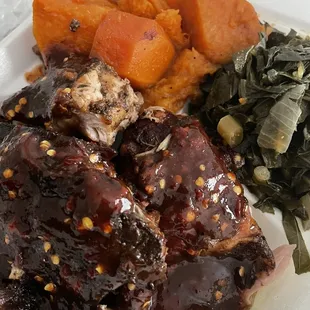 Jerk with extra sauce, yams and greens
