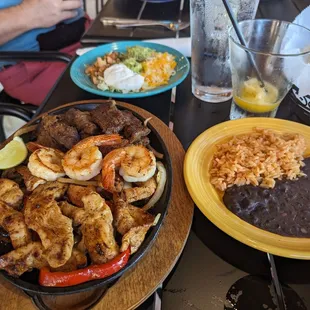 Sizzling shrimp, chicken and steak fajitas with home made tortillas.  Delish!