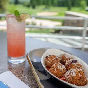 Crispy arancini with a summery cocktail