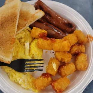 2 scrambled eggs, smoke sausage, tater tots, toast.