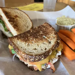 a grilled sandwich and carrots