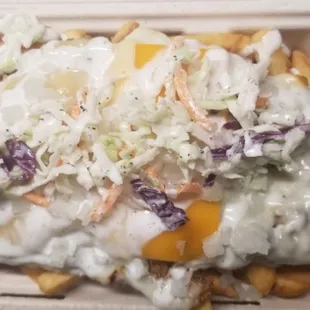 Grilla fries lay beneath your choice of meat, Muenster, Havarti, and Cheddar. Topped with Grilla sauce, onions and coleslaw.
