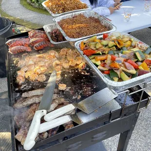 Lobster tail, steak, shrimp, grilled veggies, noodles and chicken fried rice