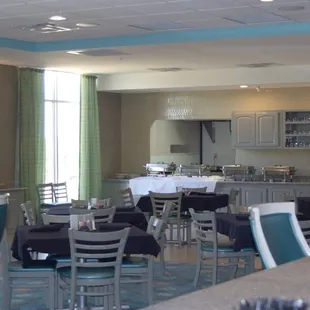 a restaurant with tables and chairs