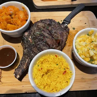 a steak, macaroni and cheese, and a side of macaroni and cheese