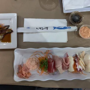 a platter of meats and vegetables