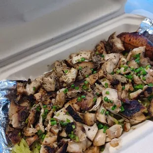 Jerk chicken on garlic herb noodles