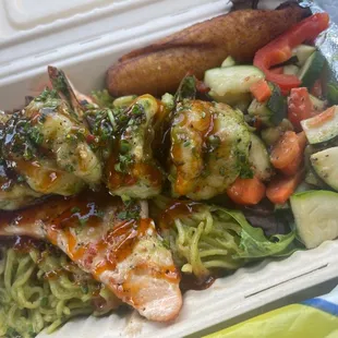 Garlic noodles with salmon veggies salad and shrimp.