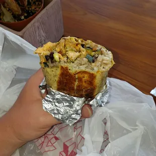 Salmon burrito w house sauce wrapped in jalapeño tortilla.