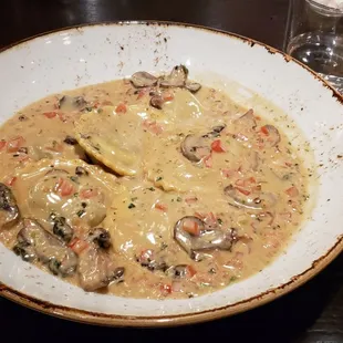 Mushroom Ravioli Mushrooms, garlic, roasted shallots, tomato, sherry cream sauce