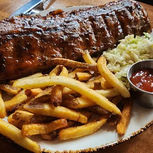 Full rack of ribs with fries - ribs were unusual with the chipotle BBQ sauce, and some of the best around this area