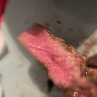 Bloody filet with tendons running through it. Can barely cut it and cannot chew it.