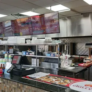 Ordering/ pick-up counter and kitchen in the back.