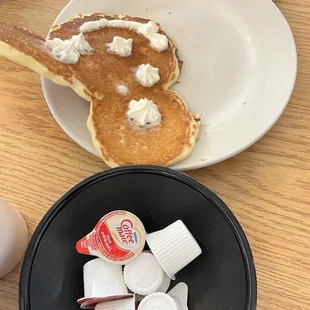 a pancake with whipped cream on top