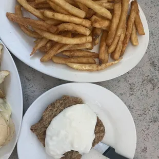 Country fried steak with fries and mine is the Philly cheesesteak sub with home chips