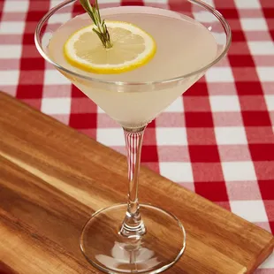 a lemon slice in a martini glass