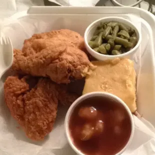 The spicy friend chicken dinner box with green beans, mashed potatoes/gravy and a side of cornbread.