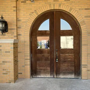 a brick building with double doors