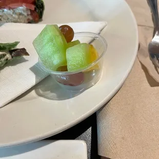 Our 1 side of fresh fruit (in a sample cup) for $1.50 added on to the price.