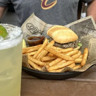 Bison burger with fries and a margarita