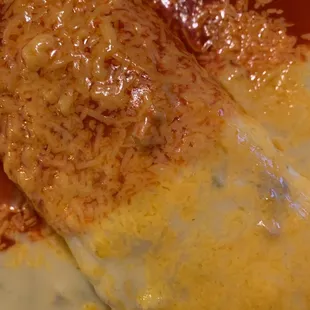 Breakfast burrito offered at night with combo of green and red sauce