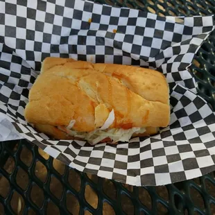a sandwich in a basket on a table