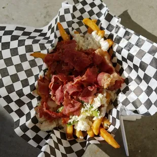 a basket of meat and cheese