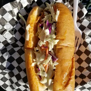 a hot dog with coleslaw slaw