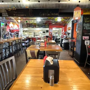 A Portion of the Divided Seating Area - Bar on the Left and Kitchen Straight Ahead