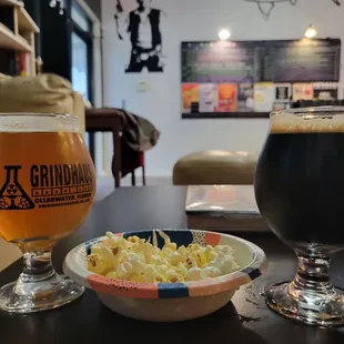 a bowl of potato salad and a glass of beer