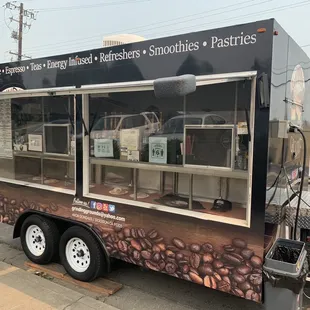 a coffee truck parked on the side of the road