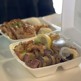 two take out containers of food