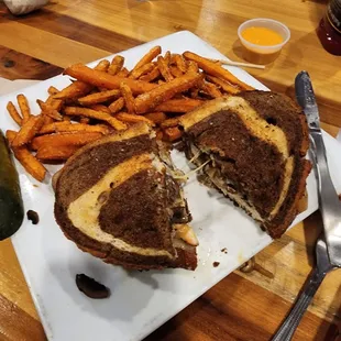 Patty melt with chicken, and sweet potato fries.