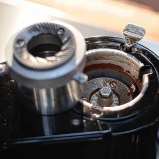 a coffee grinder being used to make coffee