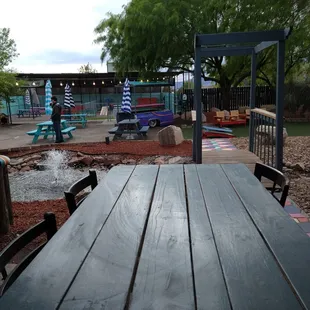 a wooden table and chairs