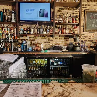 a bar with a large screen tv
