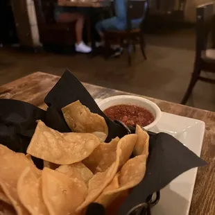 a plate of chips and salsa