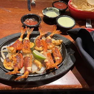 a plate of grilled shrimp