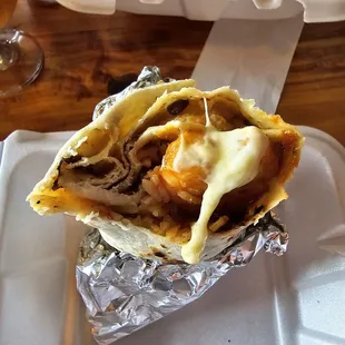 Shrimp Burrito: 12" flour tortilla with spicy grilled shrimp, sour cream, rice, beans