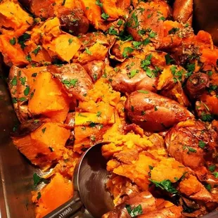 a dish of sweet potatoes and meat