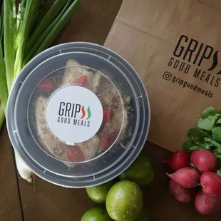 a bag of chips, radishes, limes, and radishes