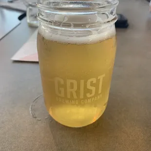 a glass of beer on a table