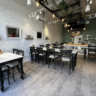 a dining room with tables and chairs