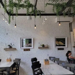 people sitting at tables in a restaurant