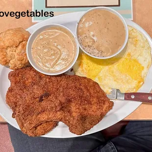 Chicken-fried, bone-in pork chops, three eggs over hard, rice with gravy, more gravy and a perfect biscuit. No room for vegetables!