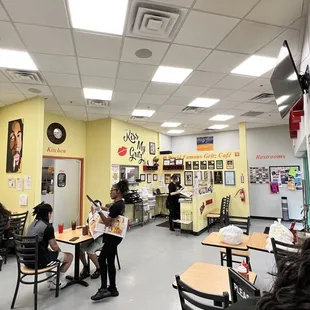 people sitting at tables and eating