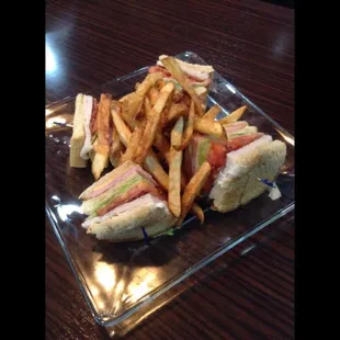 Club sandwich with ham, turkey, bacon, cheddar and Swiss cheese!  Delicious